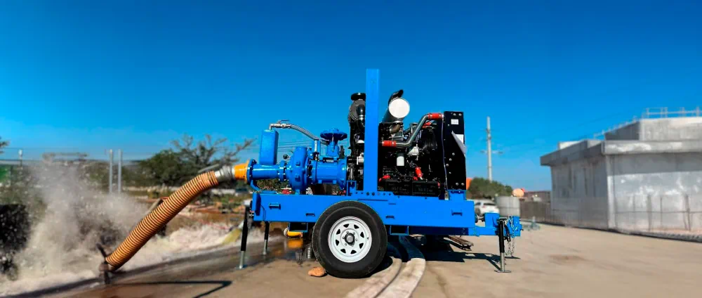 Trailer-mounted diesel sewer bypass pump in operation, demonstrating high-flow discharge capabilities for emergency municipal repairs.